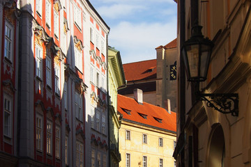 Narrow streets of old prague. Traditional bohemian building in the streets of Prague or Praha, Czech Republic, sunlight