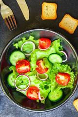  Healthy salad, leaves mix salad (mix micro greens, cucumber, tomato, onion, other ingredients). food background. copy space for text
