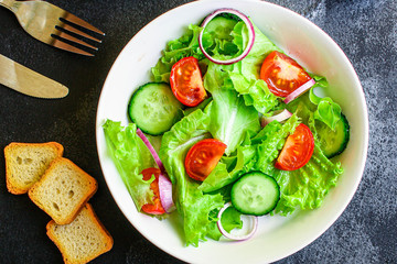  Healthy salad, leaves mix salad (mix micro greens, cucumber, tomato, onion, other ingredients). food background. copy space for text