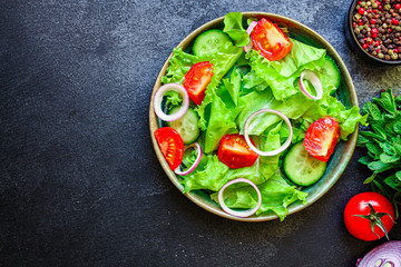  Healthy salad, leaves mix salad (mix micro greens, cucumber, tomato, onion, other ingredients). food background. copy space for text