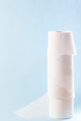 Rolls of toilet paper on color background