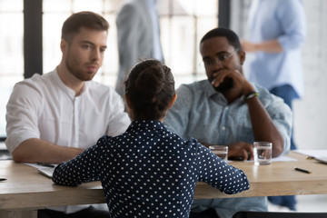 Thoughtful diverse recruiters talk interview female job applicant at meeting in office, multiracial employers feel doubtful thinking pondering of woman work candidate, hiring, recruitment concept