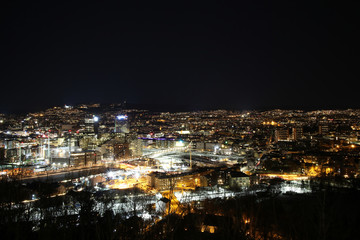 Oslo Norway Scandinavia, dark night sky aerial view on city skyline panorama, modern office building area of Oslo from as seen from Ekebergparken, long exposure photography
