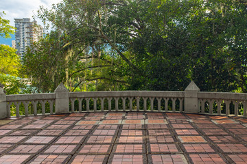 Huge Balcony with a Square Brick Floor and a Cement Railing