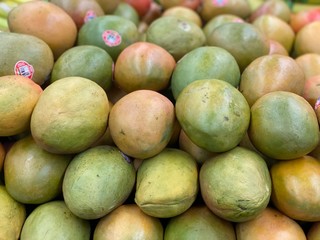 Mango organic foods. Mangoes on the super market shelf 