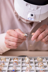 Old male jeweler at workshop