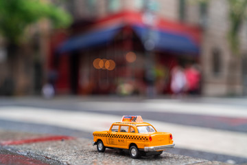 Model taxi car is parked on the corner of Bedford Street with Grove Street in Greenwich Village