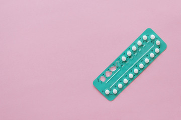 Fototapeta High Angle View Contraceptive Pill Over Pink Background obraz