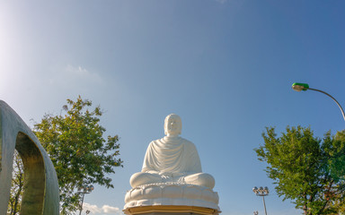 White Buddha Statue at Long Son Pagoda in sunny day at Nha Trang, Vietnam.
