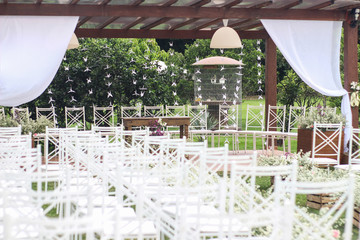 Wedding Setup. Wedding ceremony venue. Flowers, chairs and altar