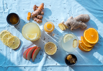Various immune boosting citrus drinks with ginger and turmeric