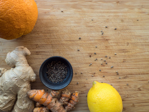 Wooden Cutting Board With Immune Boosting Ingredients Like Fruit And Ginger 