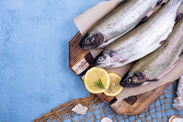 Raw uncooked trout with lemon