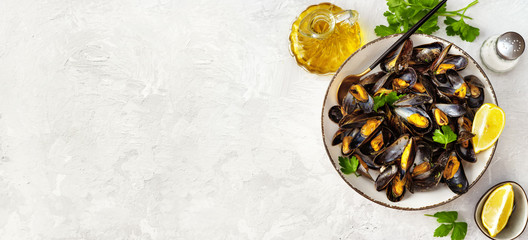 Delicious and healthy steamed mussels on white background