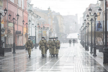 Bolshaya Pokrovskaya street in Nizhny Novgorod without people during a snowfall masks a military patrol restricting the movement of people during quarantine on coronavirus (chovid-19)