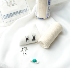 Fototapeta na wymiar Medical instruments, including dressing, cotton bandage, pill and capsule medication, and bandage staples