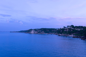 Fototapeta premium The beautiful nature of Indonesia and the island of Bali. Slopes and cliffs overlooking the waves of the blue ocean. Tropical and exotic view of travel to Asia
