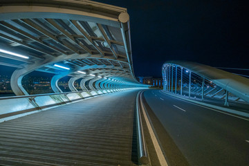 Fototapeta premium bridge with tubular structure, illuminated without people