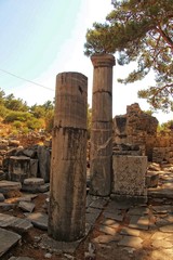 old ruins of the ancient temple of Athena in Priene in Turkey on a hot summer day
