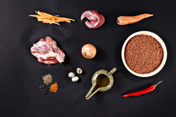 Ingredients of pilaf on black background.