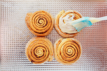 Stack of freshly cinnabon, French buns with cinnamon and cream