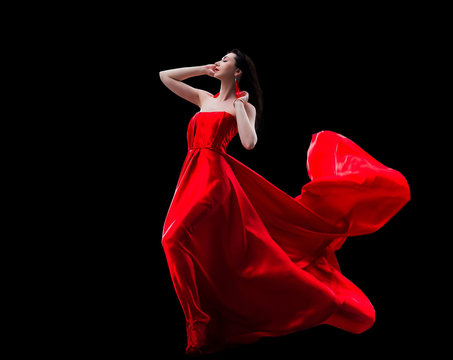 Gorgeous Woman In Red Fluttered Dress Isolated On Black Background