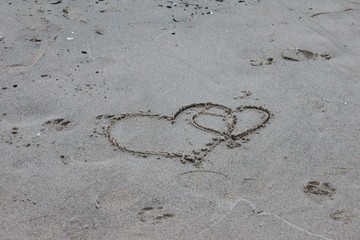 Interlocked Hearts in the Sand