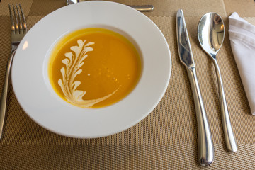 pumpkin and orange cream on white plate