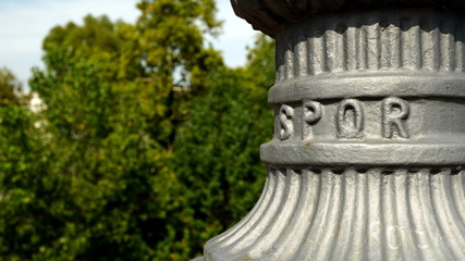 Detail of cast iron lamppost stand on a bridge with SPQR written (from the Latin Senatvs PopvlvsQve...