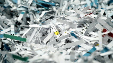 paper scraps of shredded documents seen in detail. Conceptual image for privacy, fake news