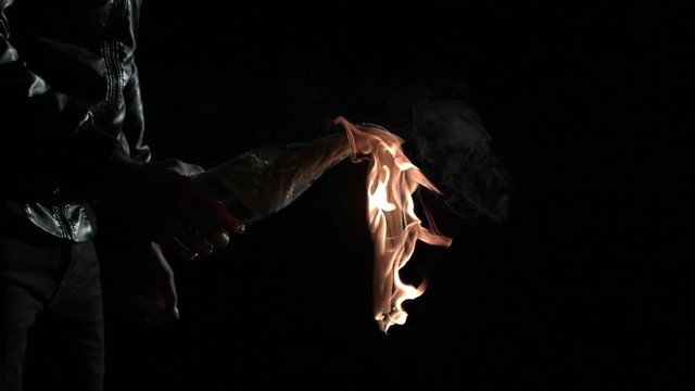 Extreme slow motion shot of a burning molotov cocktail. 