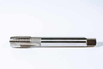 Tap for threading in metal. Tool for metal processing.
