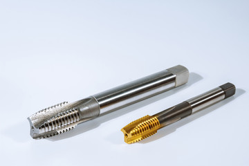 Tap for threading in metal. Tool for metal processing.