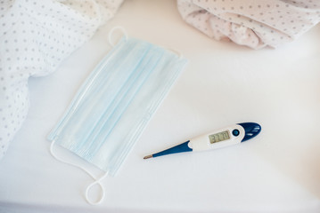 Masks, tablets, and a close-up thermometer with free caption space. The virus and the epidemic