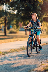 Fototapeta na wymiar Girl riding bicycle during coronavirus