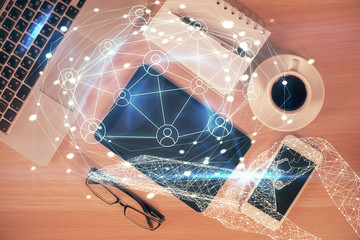 Double exposure of social network theme drawing over table with phone. Top view. People connecting...