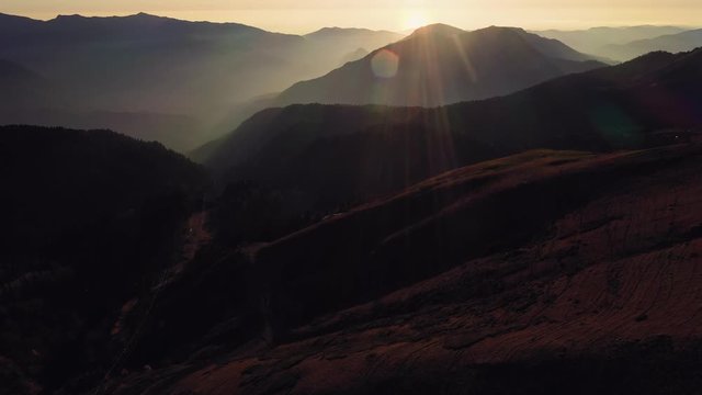 Aerial view of the wonderful sunset in the mountains in the autumn in Krasnaya Polyana Sochi