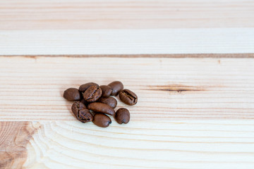 Coffee beans on wooden board