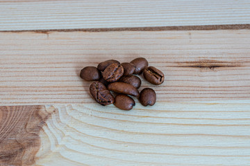Coffee beans on wooden board