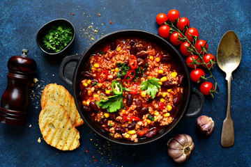 Chili con carne - traditional mexican minced meat and vegetables stew in tomato sauce. Top view...
