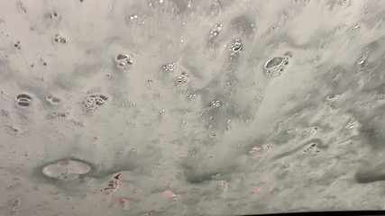 Automatic car wash in action. View from the driver's seat