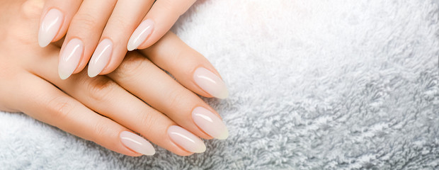 Obraz na płótnie Canvas Manicured nails and Soft hands skin wide banner. Beauty treatment.