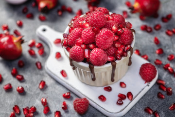 Raspberry mug cake in a red ceramic mug on dark background