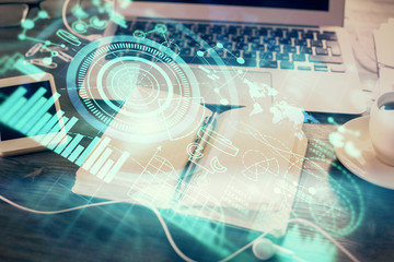 Double exposure of business theme drawings and desk with open notebook background. Concept of international market