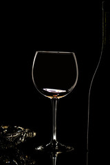 Fototapeta na wymiar Glass of wine in black background
