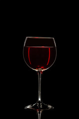 Glass of wine in black background