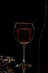 Glass of wine in black background