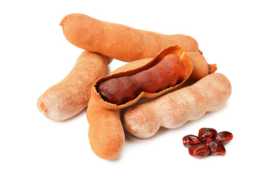 fresh tamarind fruits isolated on white background