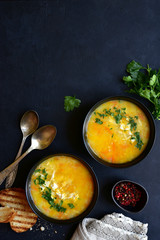 Thick chicken soup with millet and vegetables. Top view with copy space.