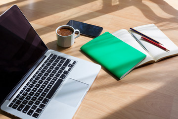 laptop, pen, notebook, mobile phone and coffee on the table. Study, work desk. Online education. Home office.